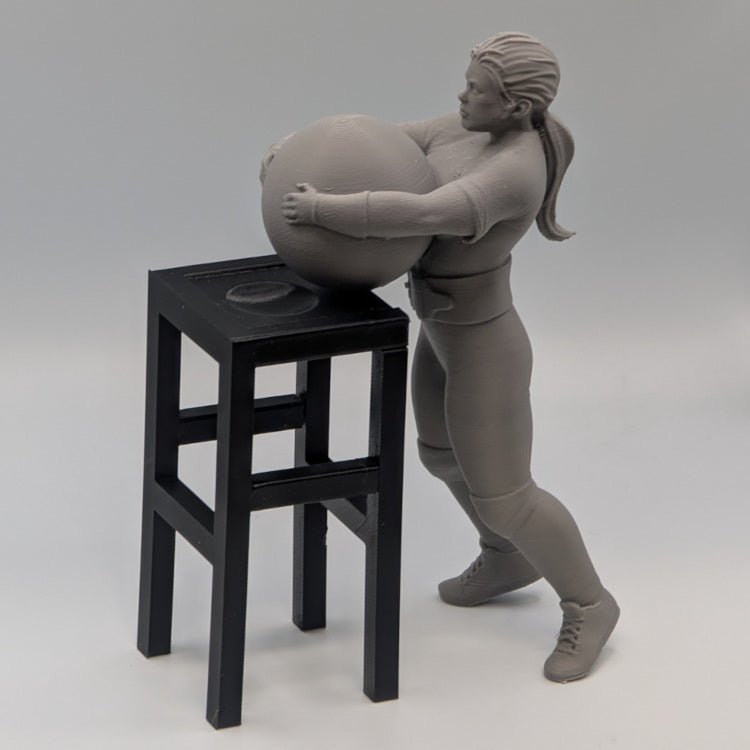 Strongwoman Lifting an Atlas Stone - Figures of strength